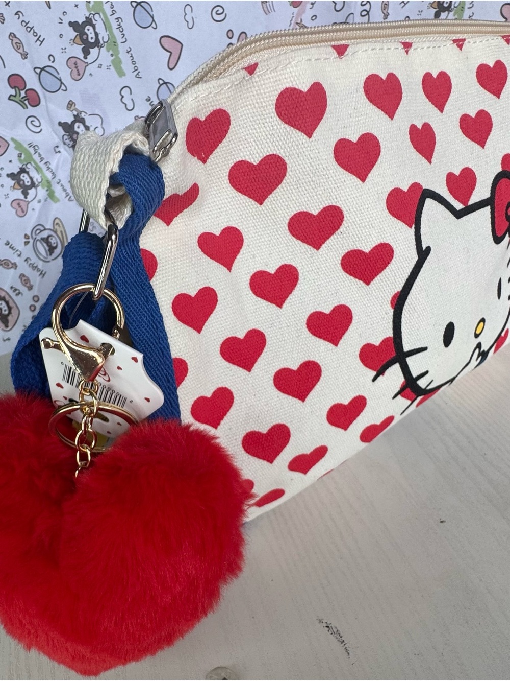 Hello Kitty Canvas Crossbody Bag in Red, Blue, Cream with Plush Red Heart Charm - Picture 8 of 8